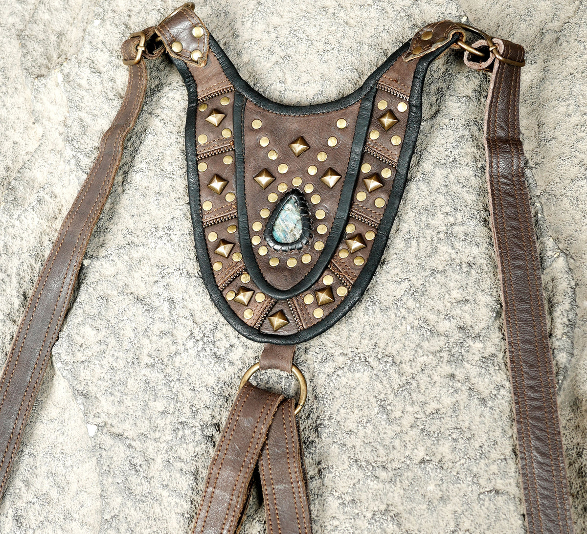 Unisex festival bag harness featuring two brown leather pouches and brass-tone fittings