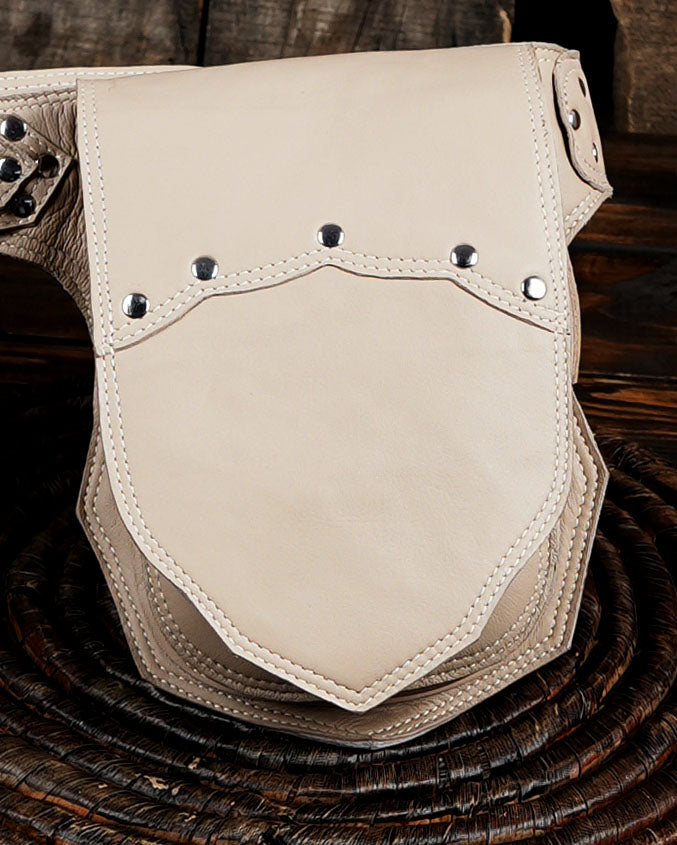 Light colored leather accessory belt, ring hardware focus