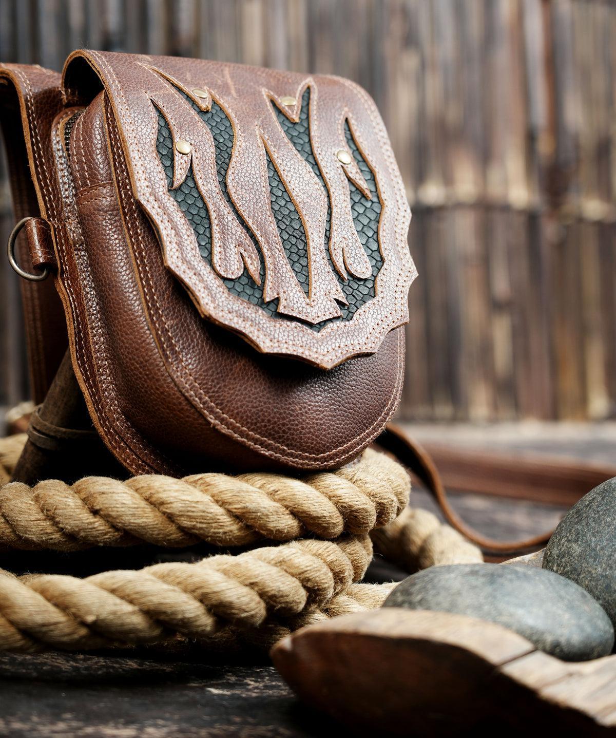 Adjustable brown leather thigh bag harness with two front pouches