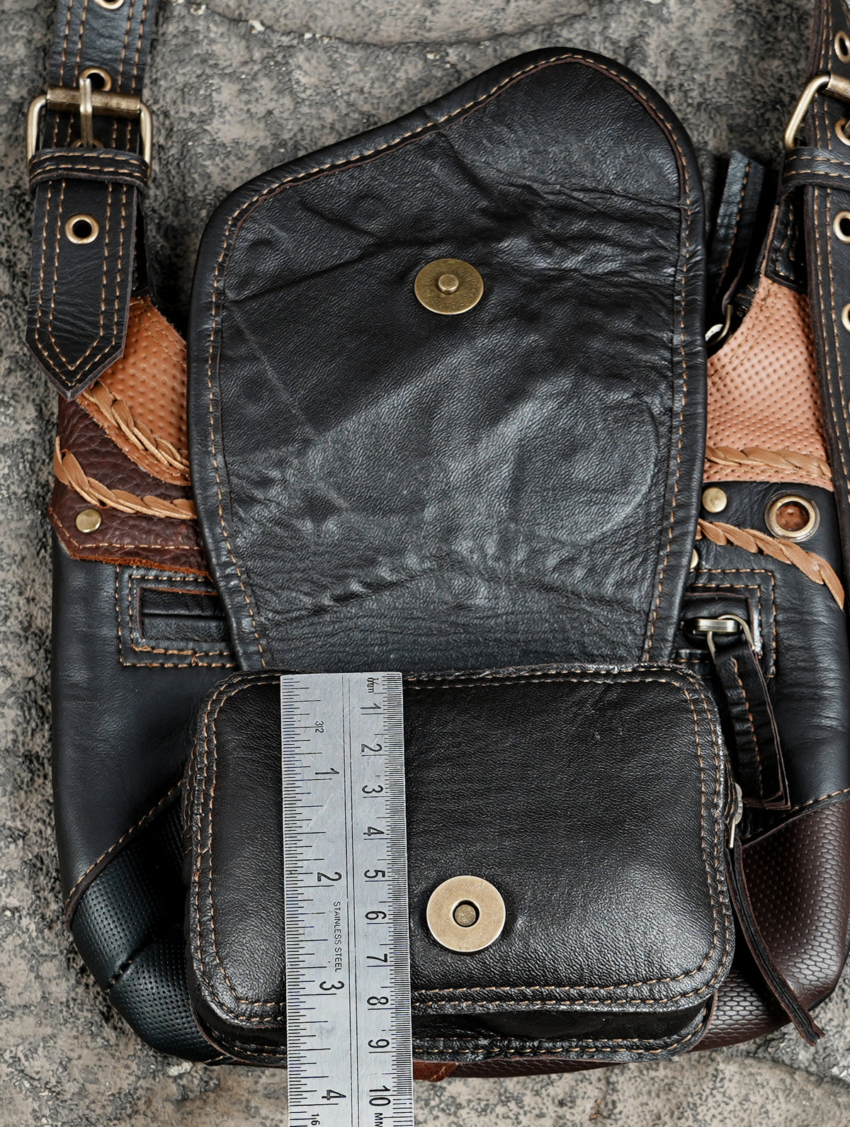Distressed brown leather utility harness with studded patchwork bags