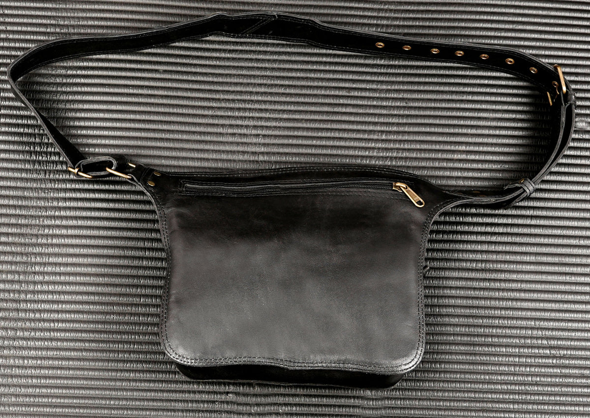 Men's black leather waist bag with adjustable strap and buckle