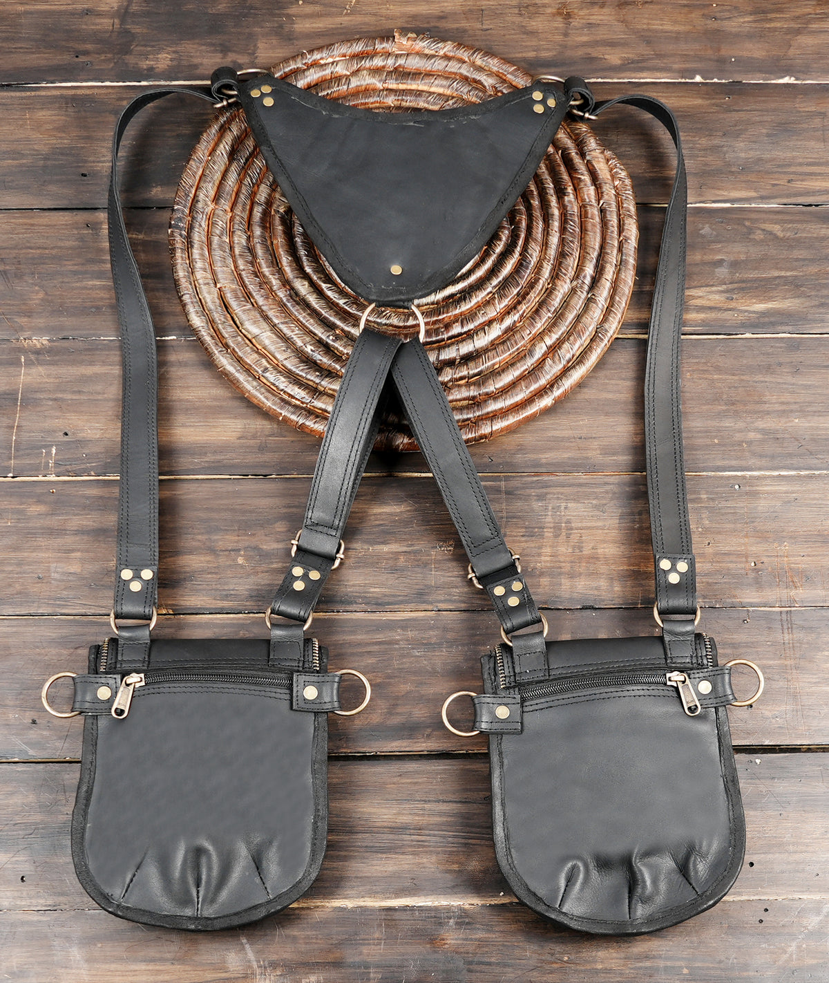 Black leather hip pouch harness for rave outfits and alternative fashion styling
 