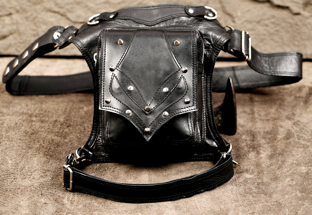 Minimalist leather thigh pouch, stud detail close up
