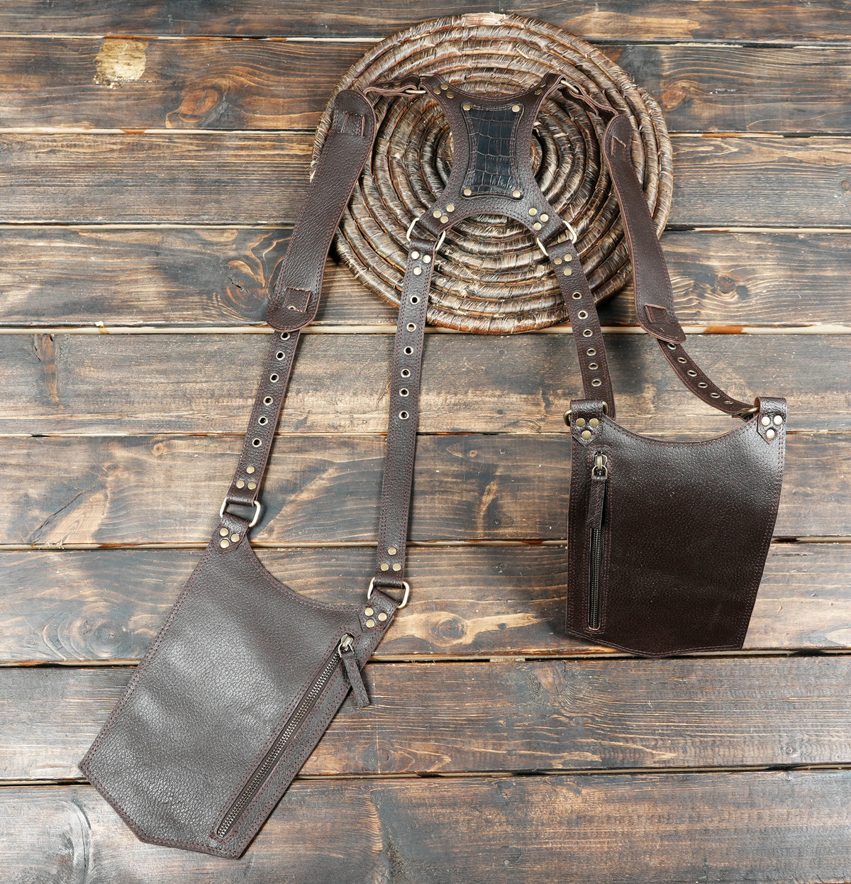 Handmade leather thigh holster accessories for steampunk cosplay and gothic outfits.