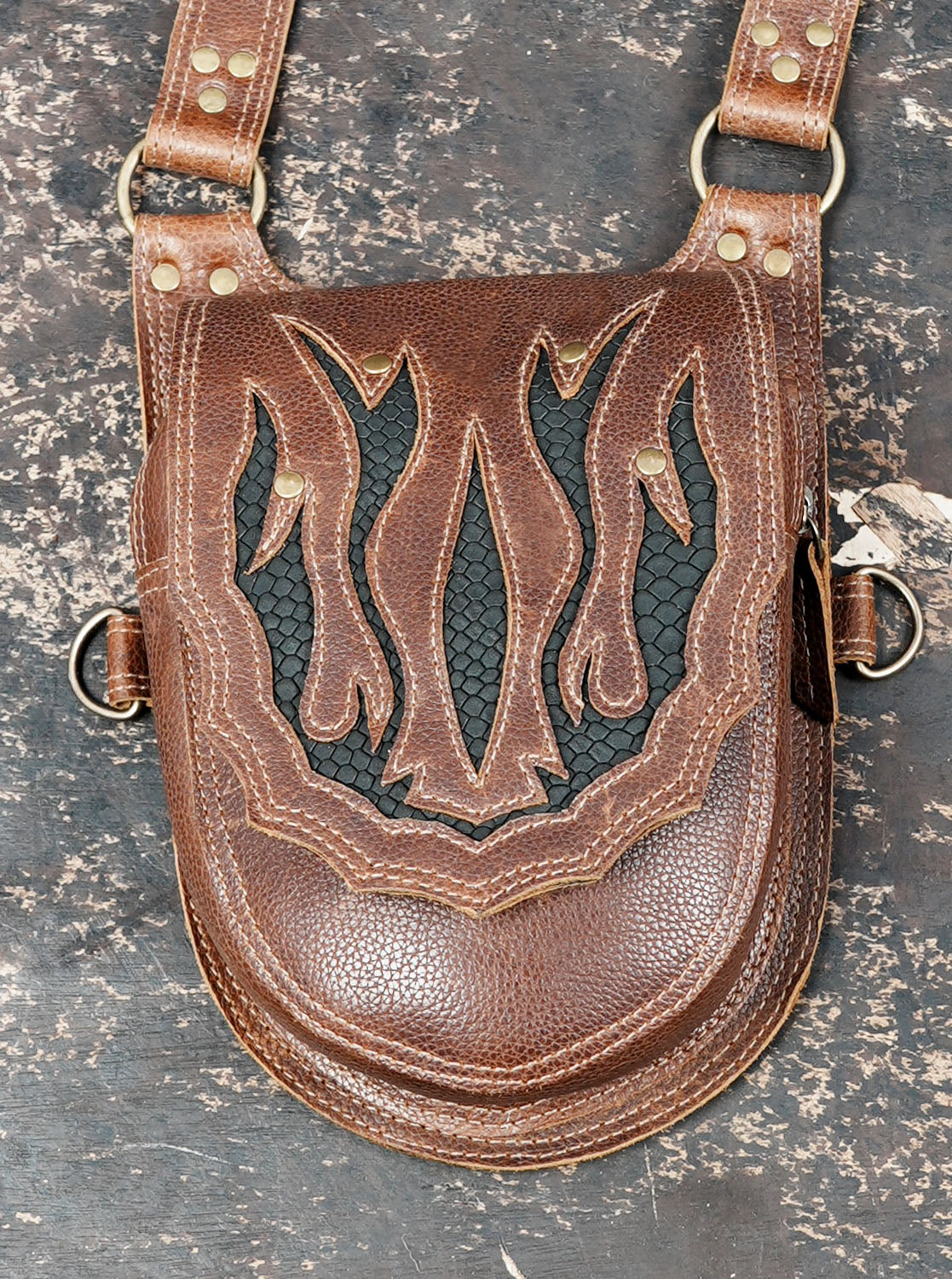 Steampunk-inspired brown thigh holster with matching decorative leather panels