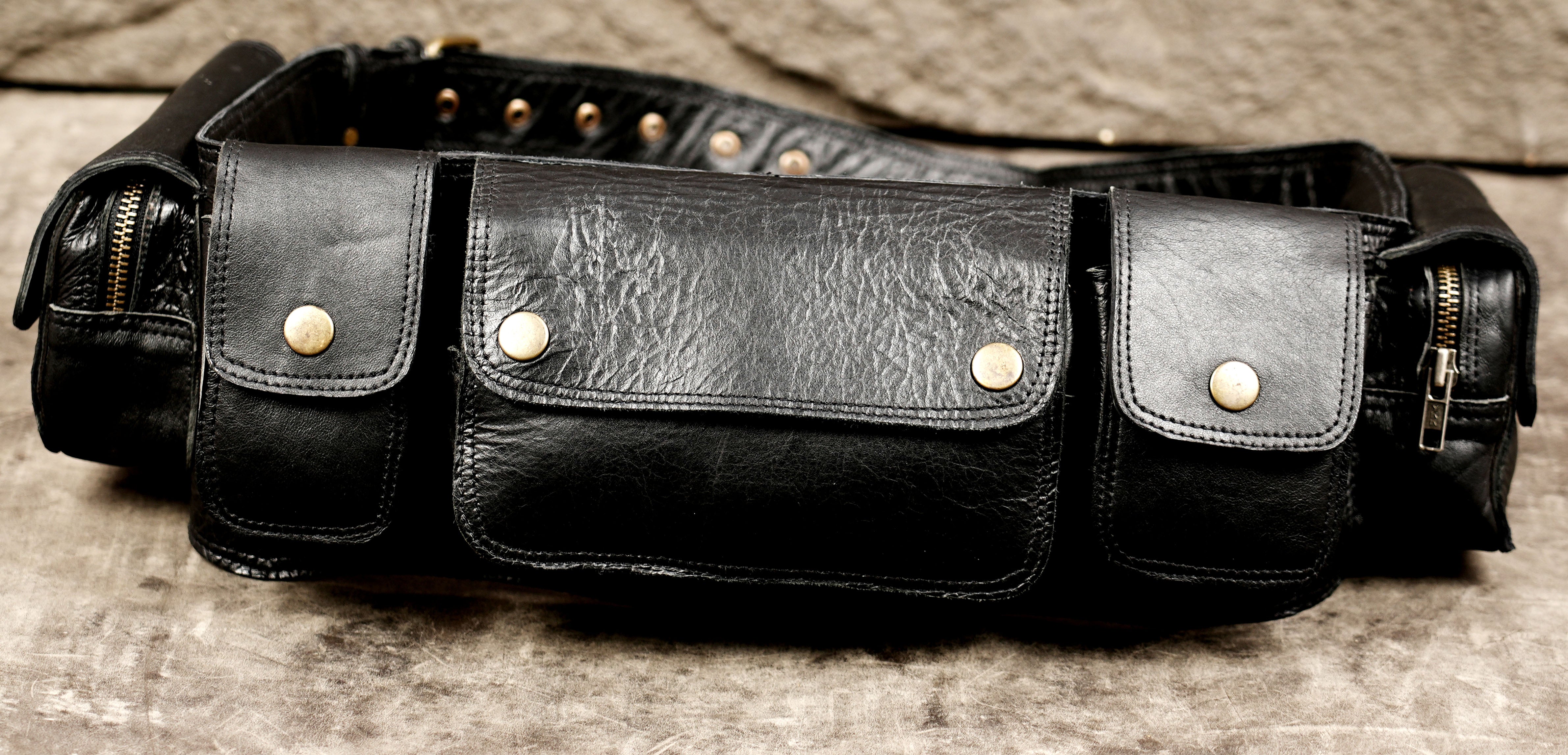 Multi-pocket black leather utility belt for festivals and travel