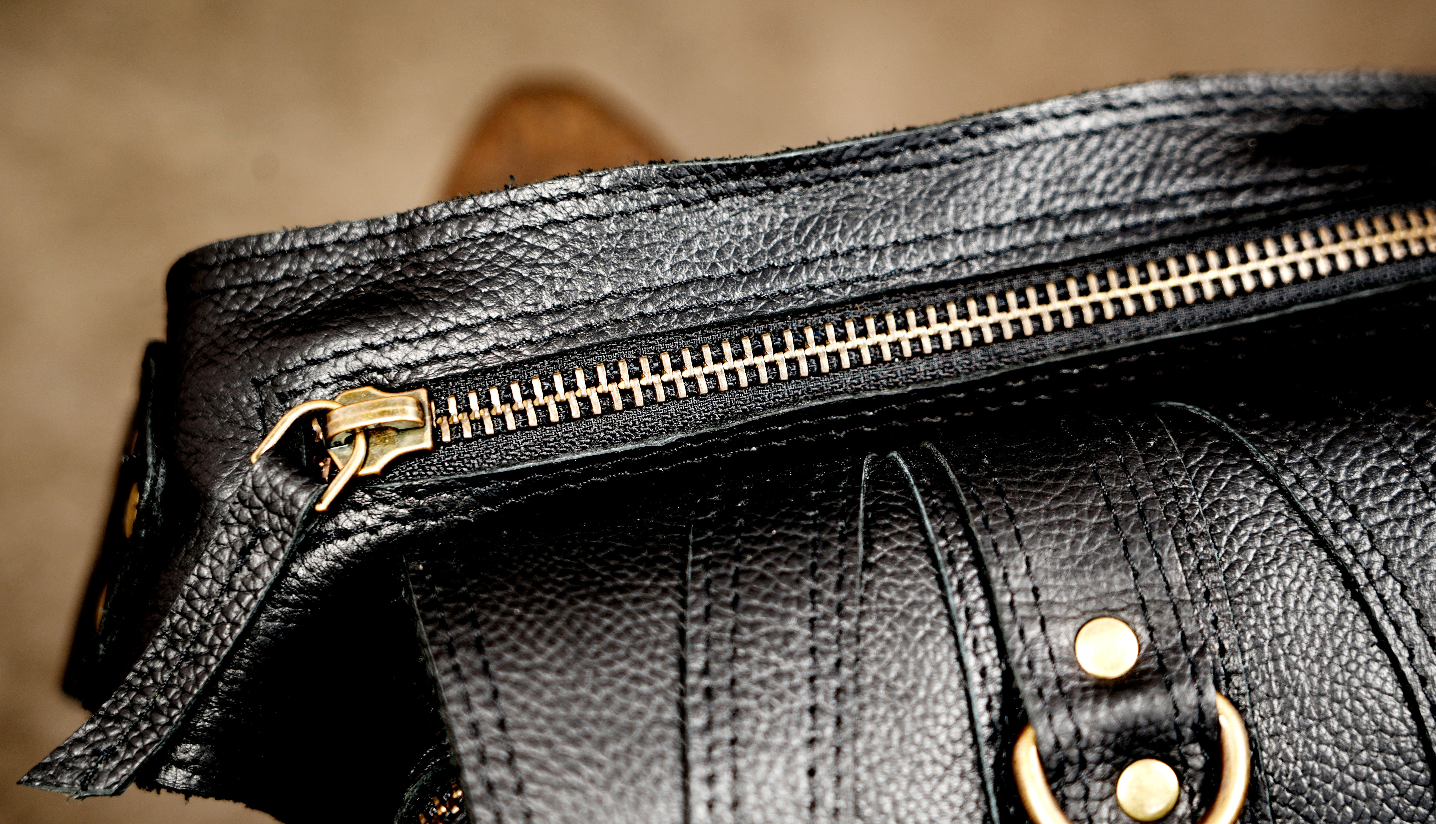 Multi-pocket leather utility bag for hands-free everyday use