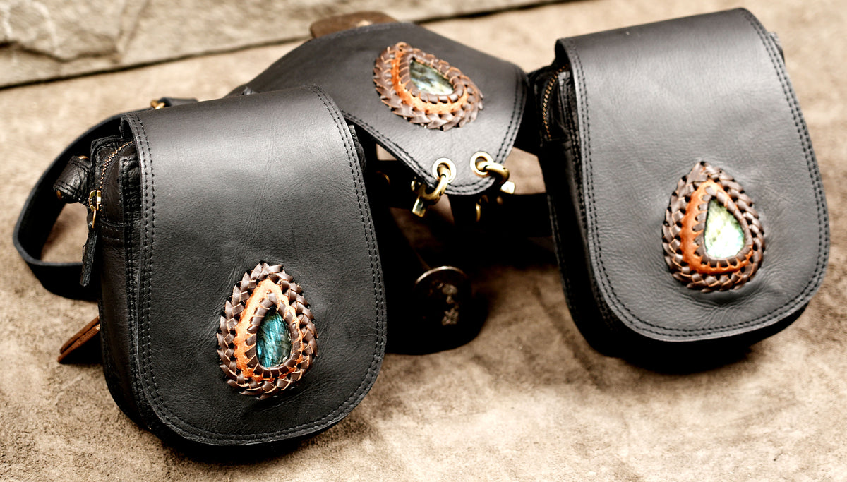 Black leather festival harness bag with adjustable straps and metal buckles
