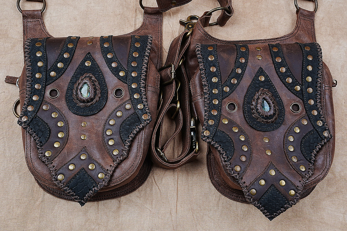Handcrafted leather festival bag with matching hip pouches and antique brass hardware