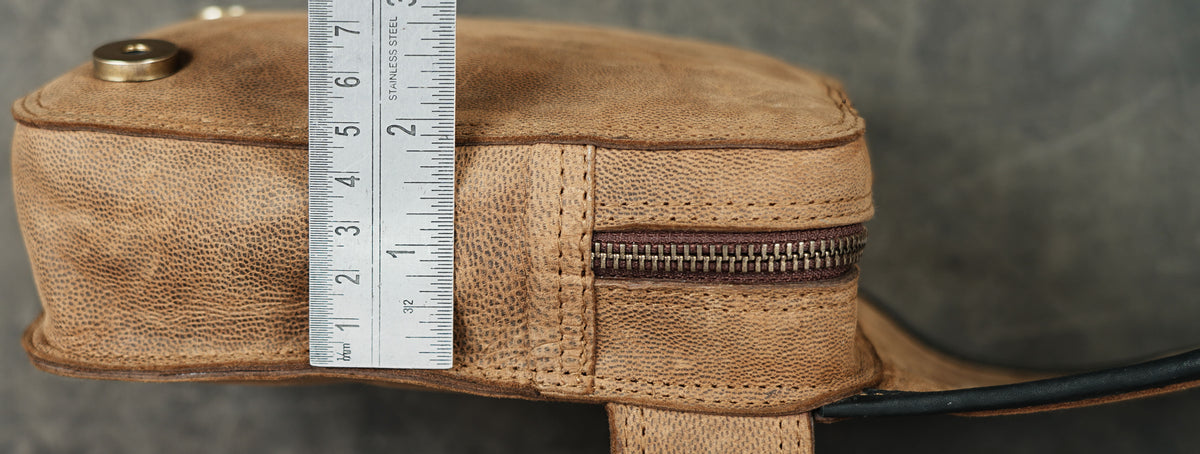 Multi texture leather pouch with labradorite gem, close up
