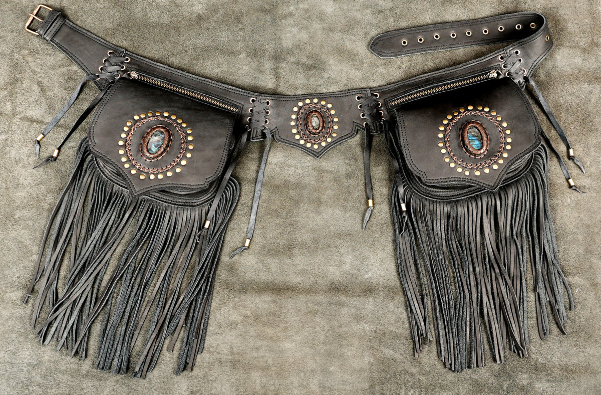 A dark brown leather fringed pouch belt with western-style conchos and turquoise accents.