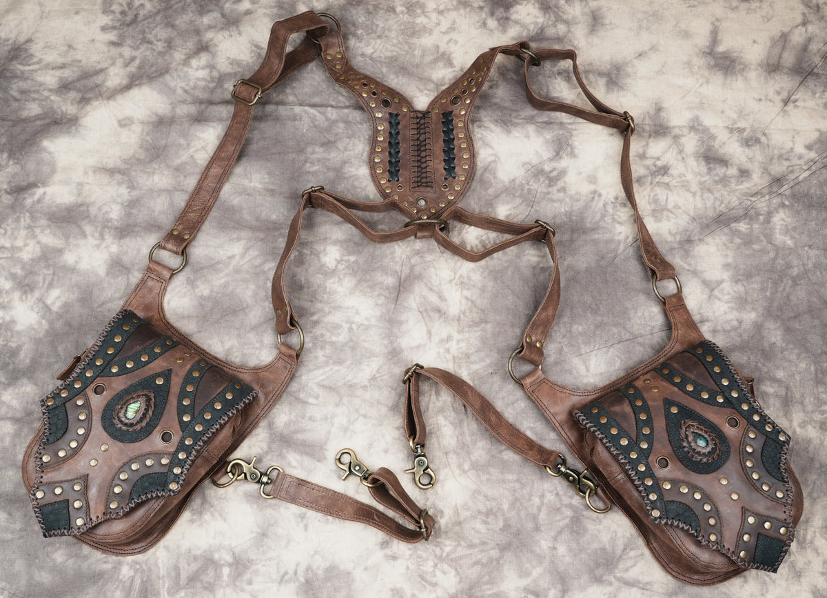 Festival wear accessory in brown leather with dual storage compartments and detailed handcrafted trim.