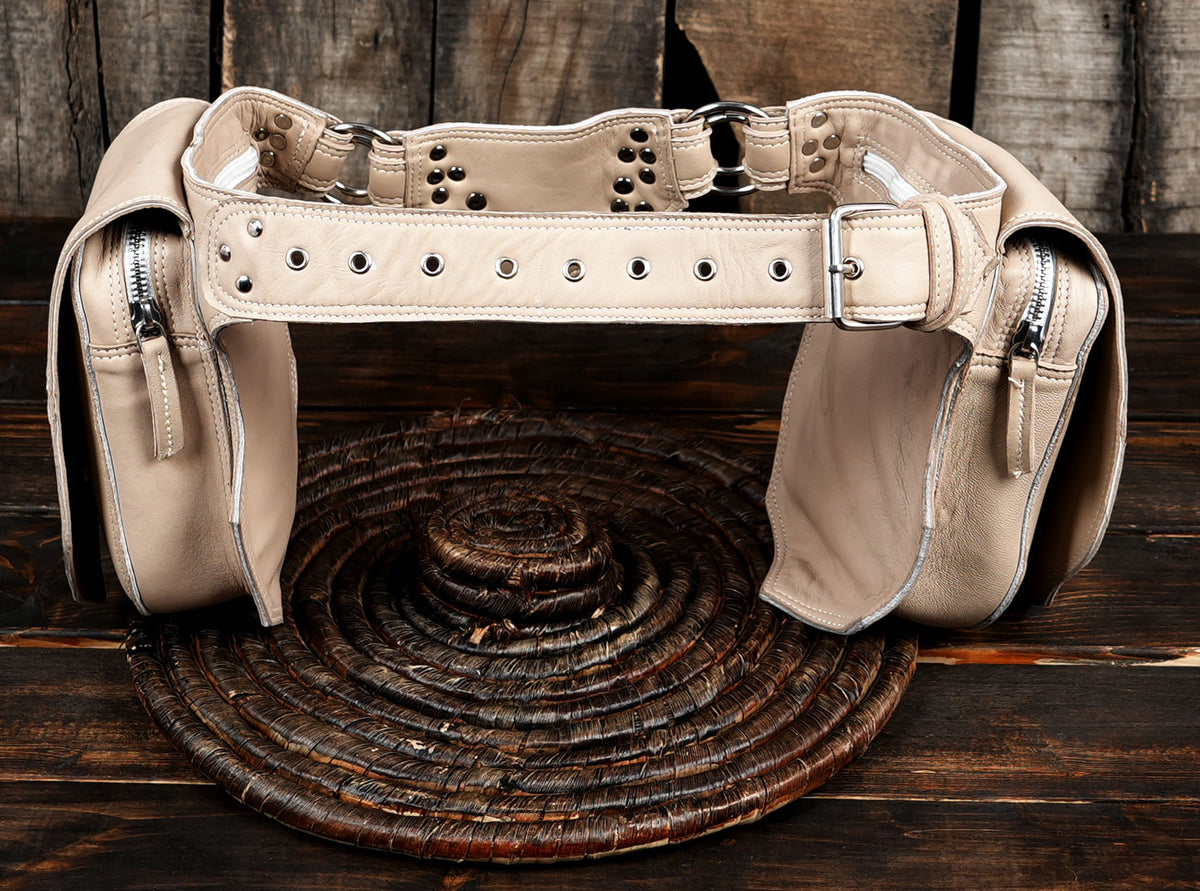 Pale leather accessory belt with stud and grommet detail