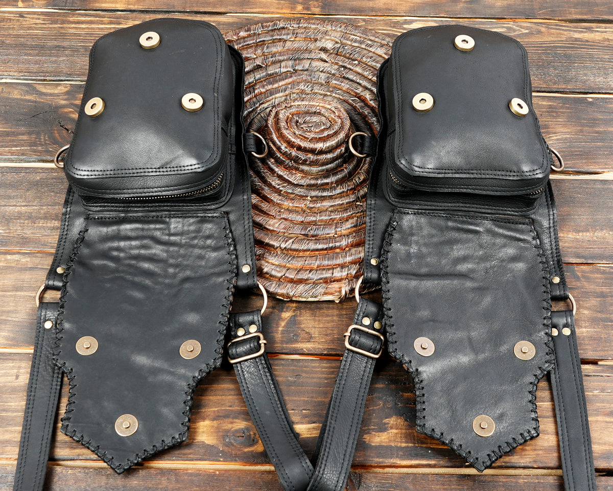 Double leather holster harness with decorative gemstone settings and black stitched edges
