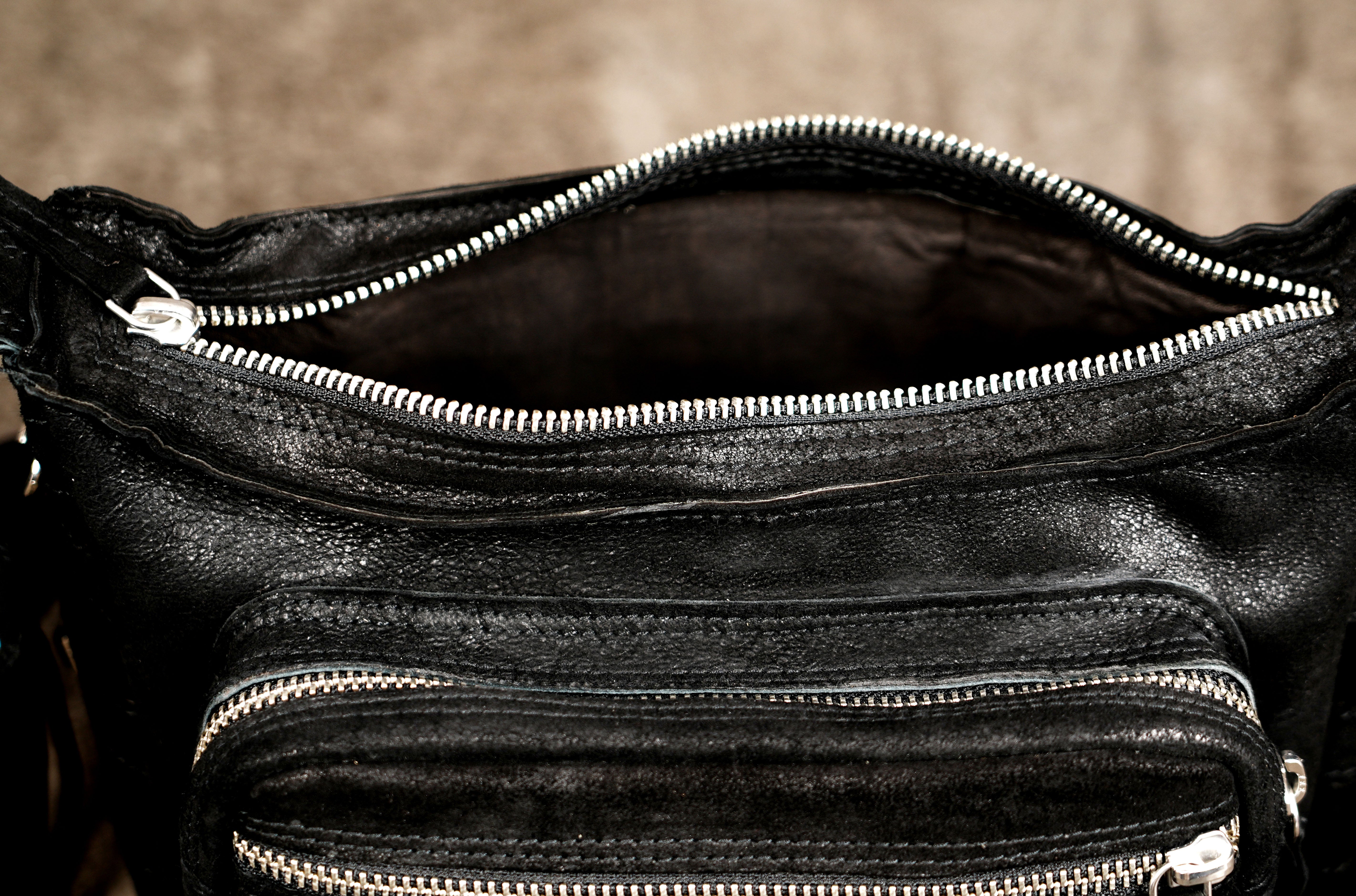 Punk leather crossbody purse with stud rows and fringe