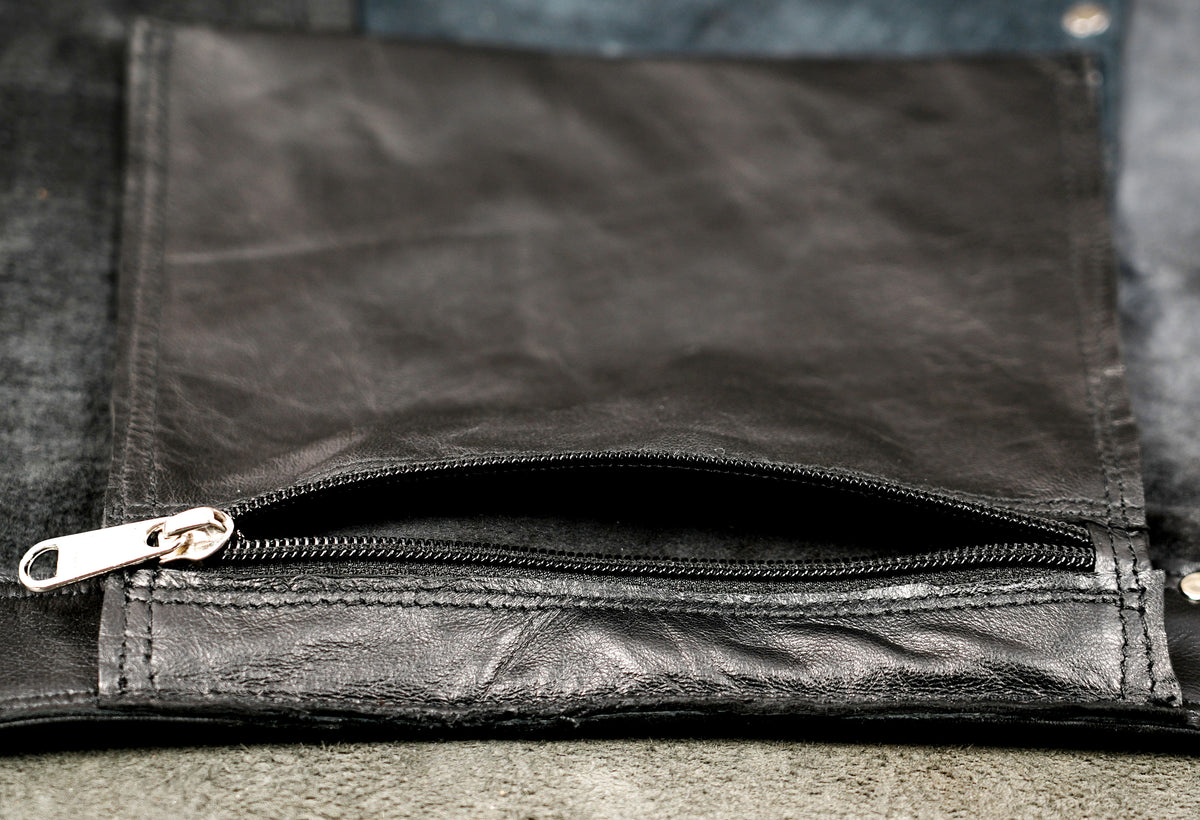 Punk rock black leather skirt with metal ring accents