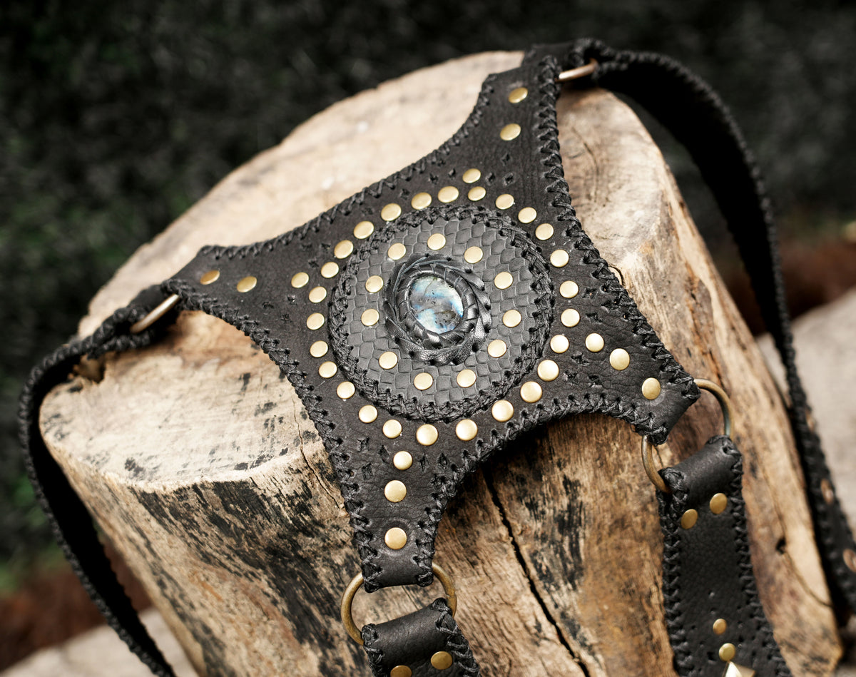 Steampunk double thigh holster set featuring studded black leather pockets and decorative stone accents.