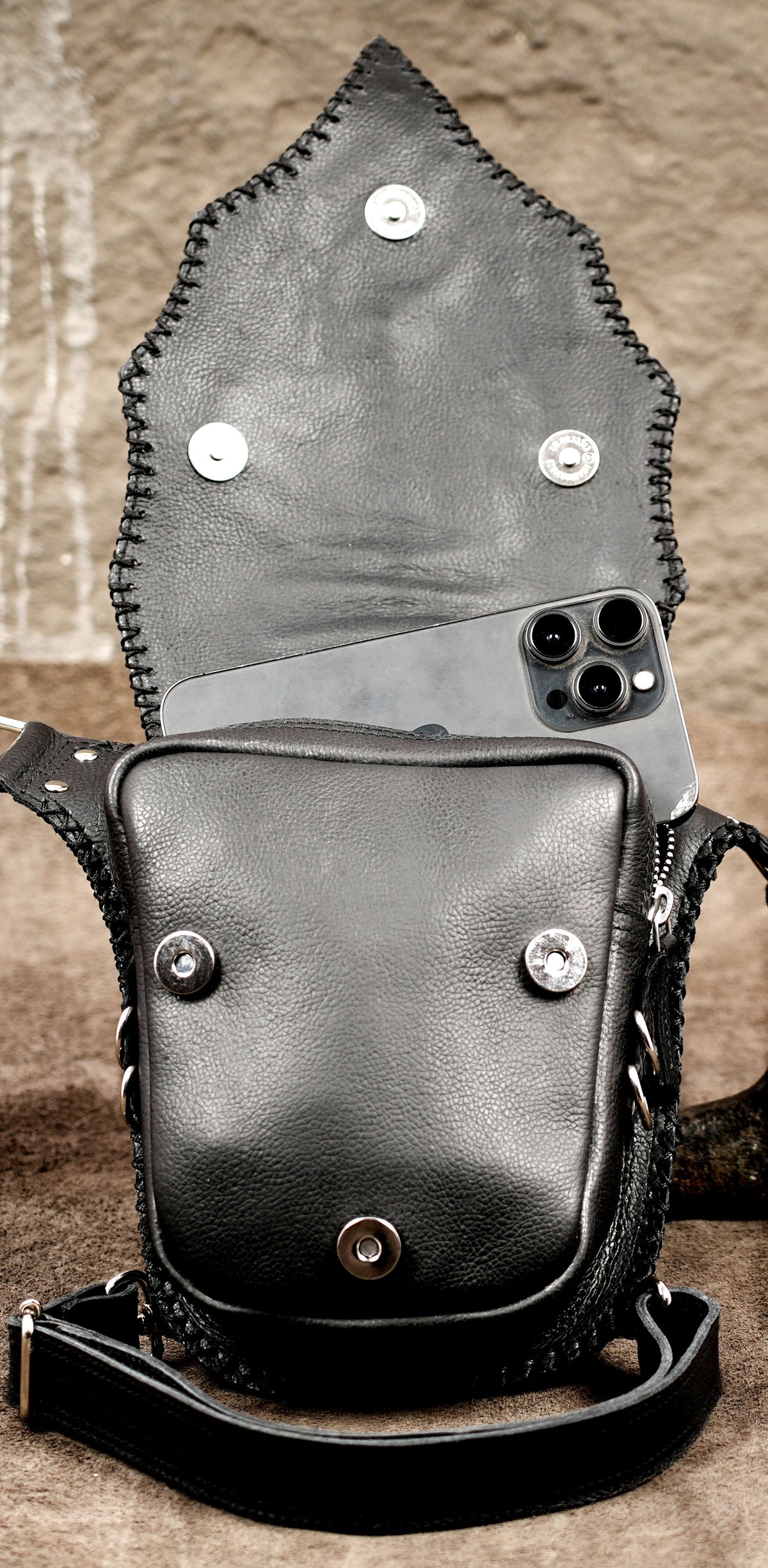 Rave ready leather holster with metallic spike detail