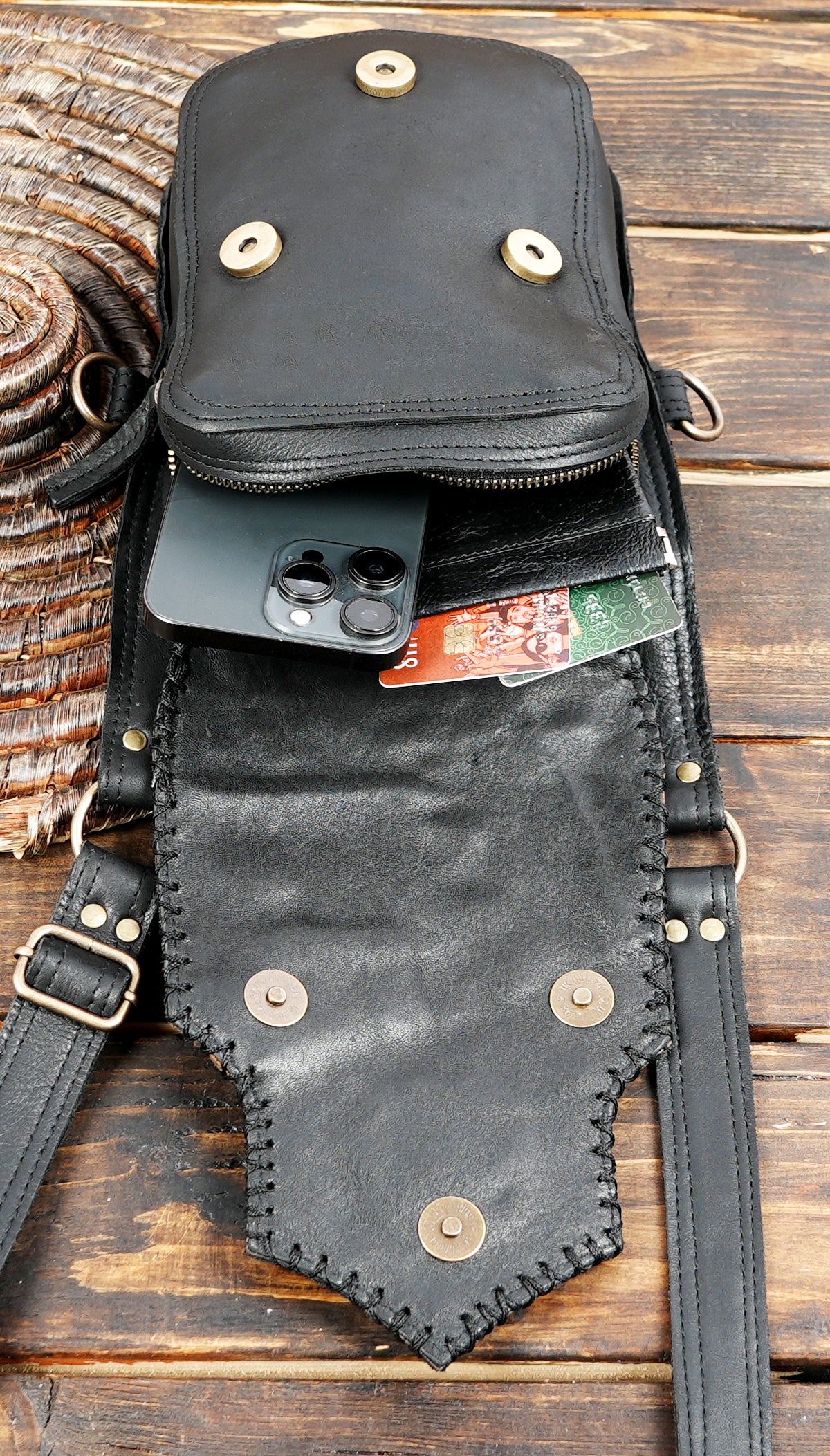 Black and brown leather crossbody hip bag with twin pockets and antique brass fittings