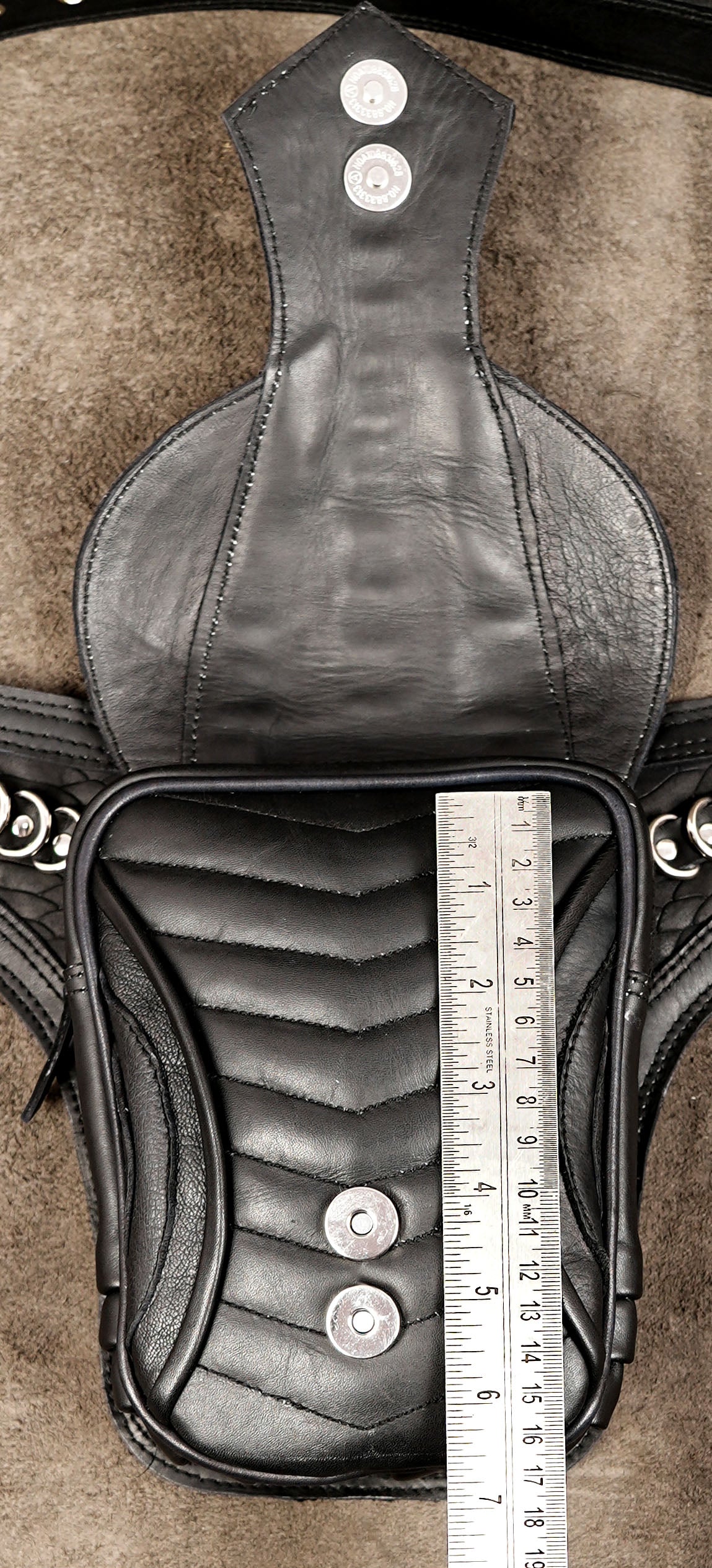 Sci-fi inspired leather bag with chrome ring detailing
