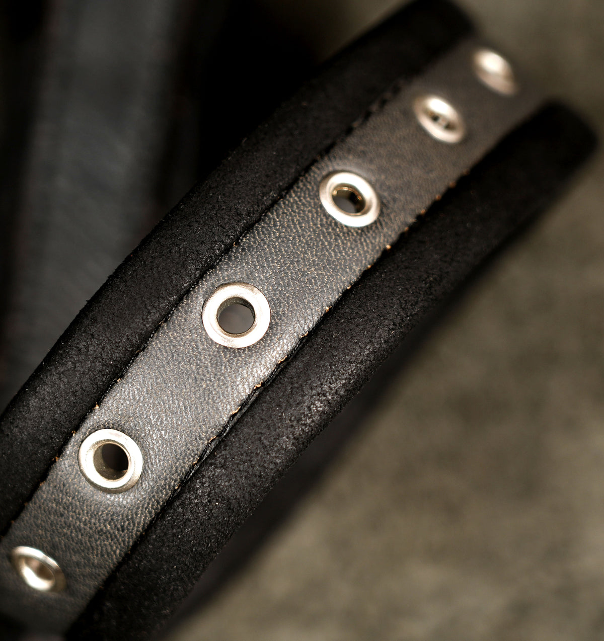 Sci-fi inspired leather thigh bag, stud pattern close up