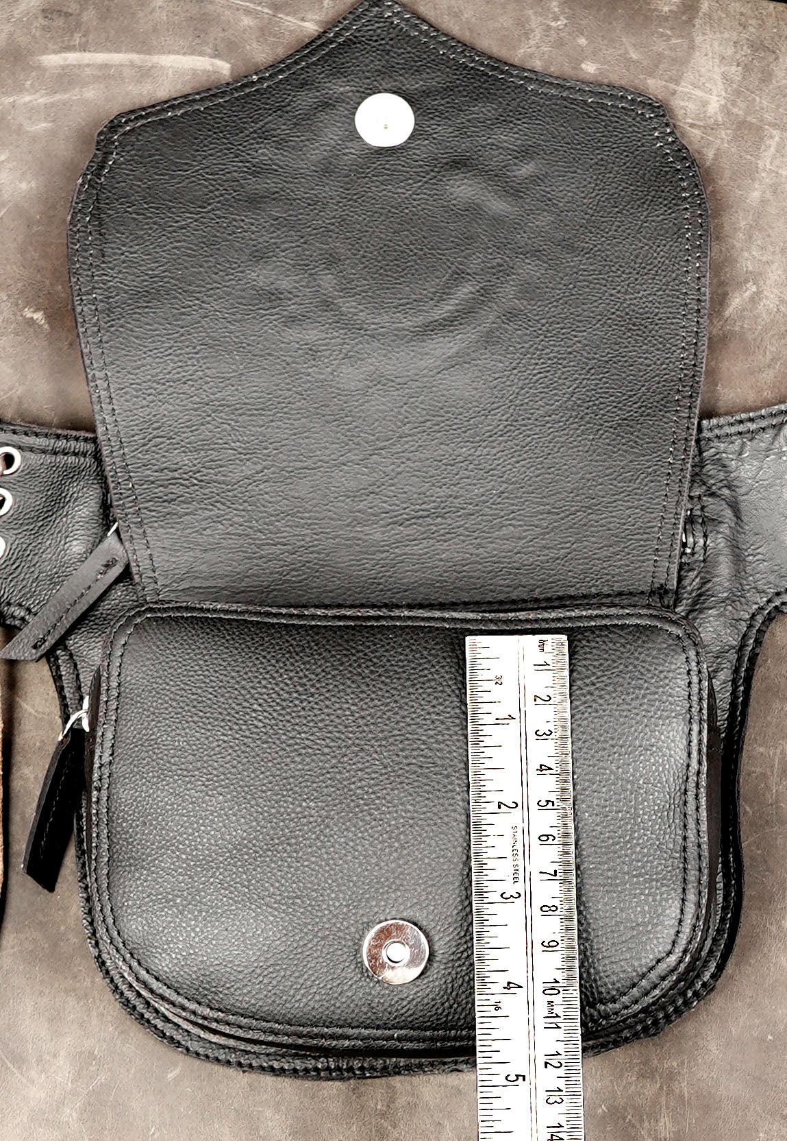 Shield silhouette leather bag with natural stone accent
