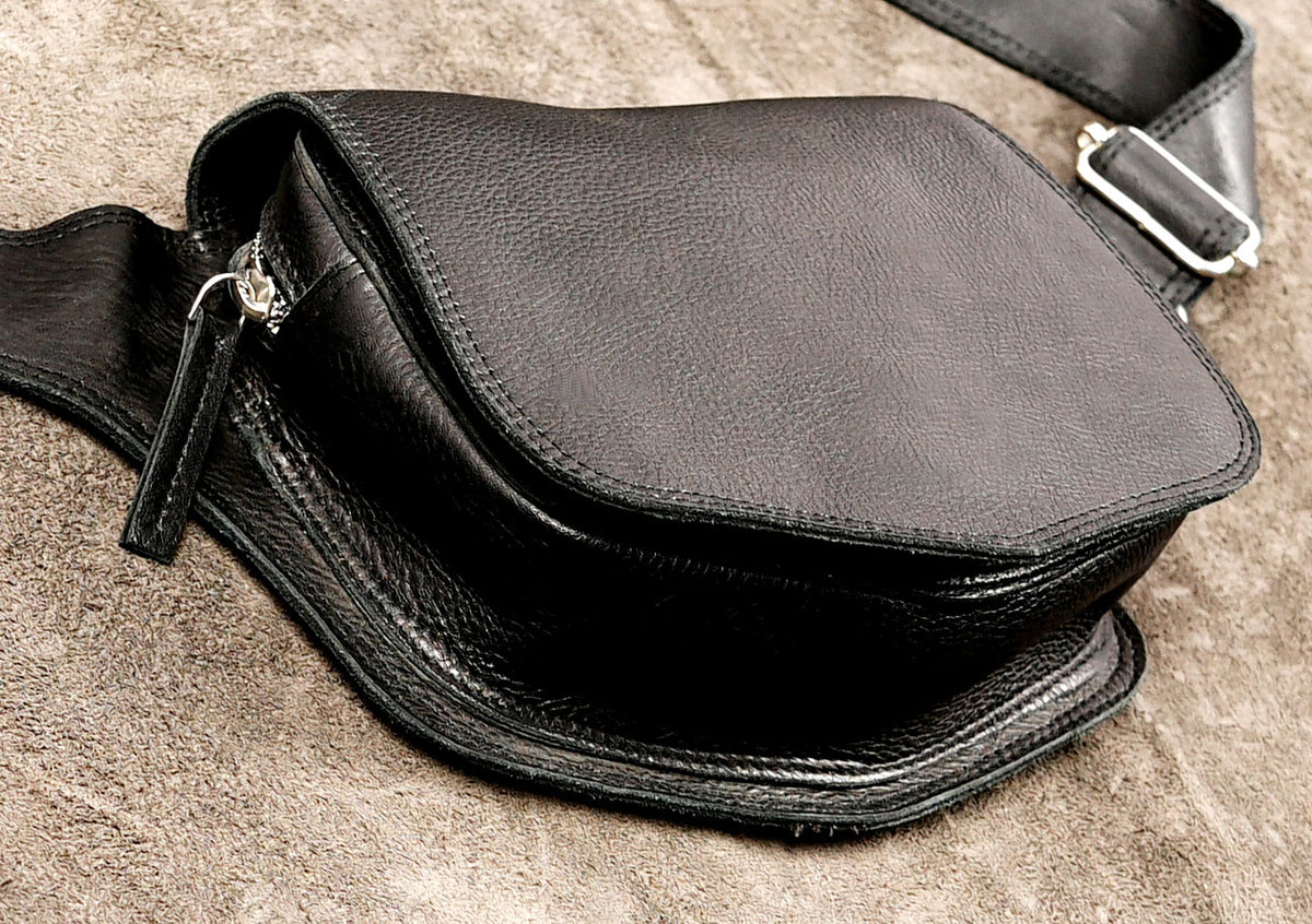 Sleek black leather pouch with side zip pocket