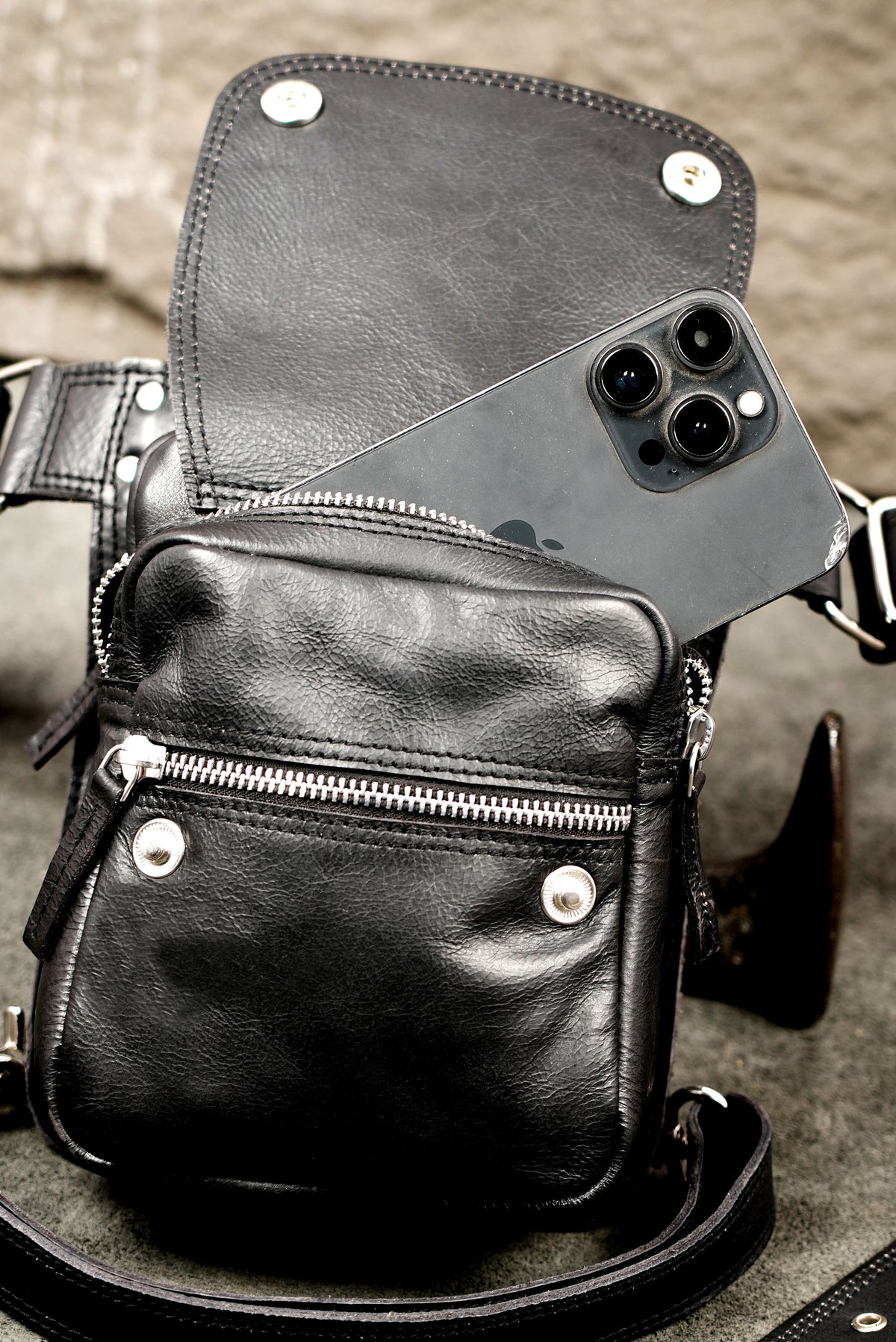 Sleek style leather thigh holster, top flat lay view