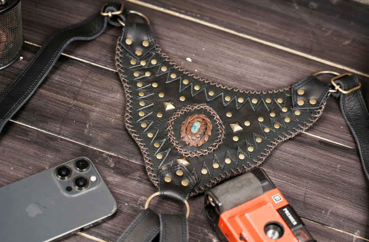 Black leather utility hip bags with multiple compartments and metal studs
 