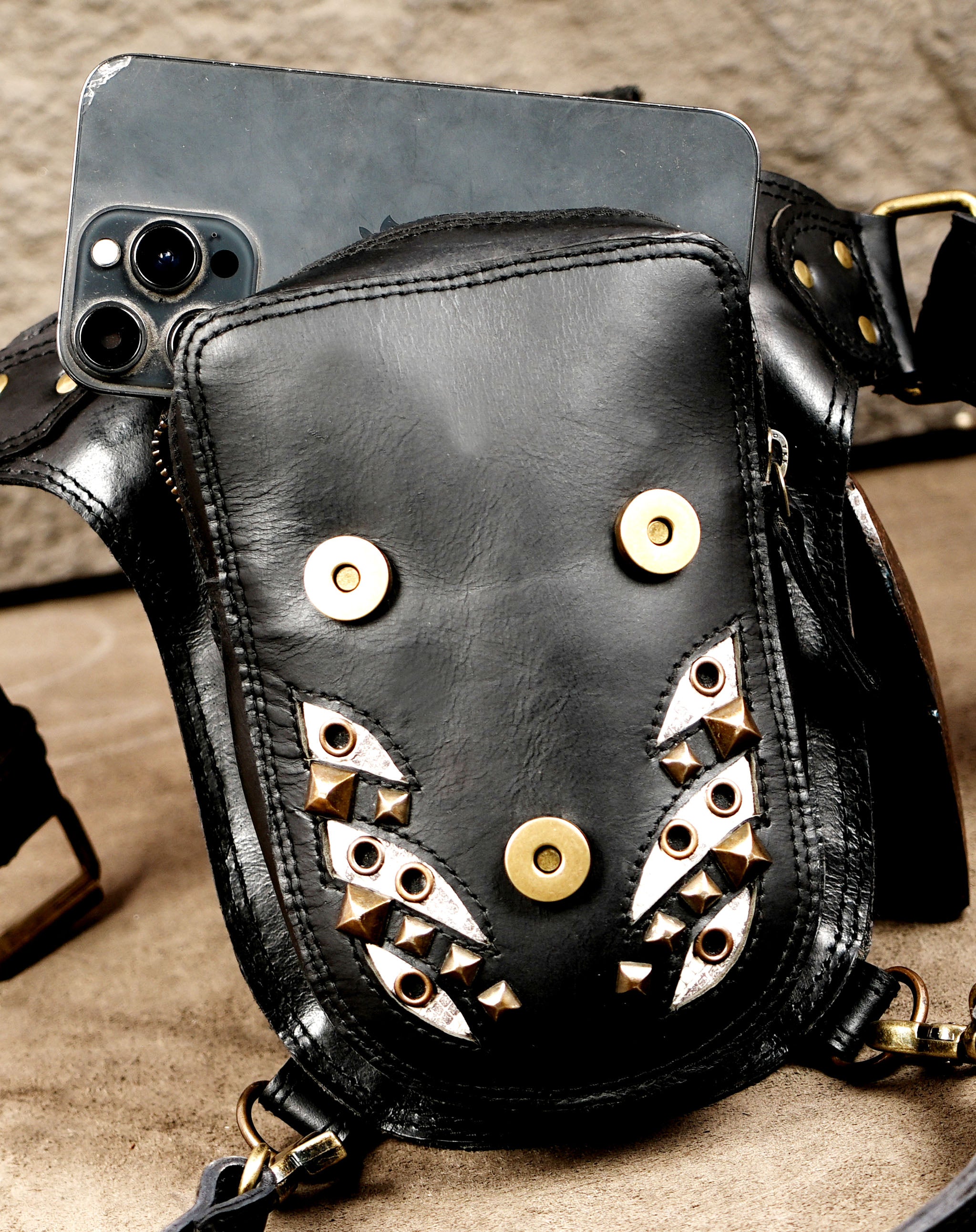 Steampunk-inspired leather waist bag with brass accents