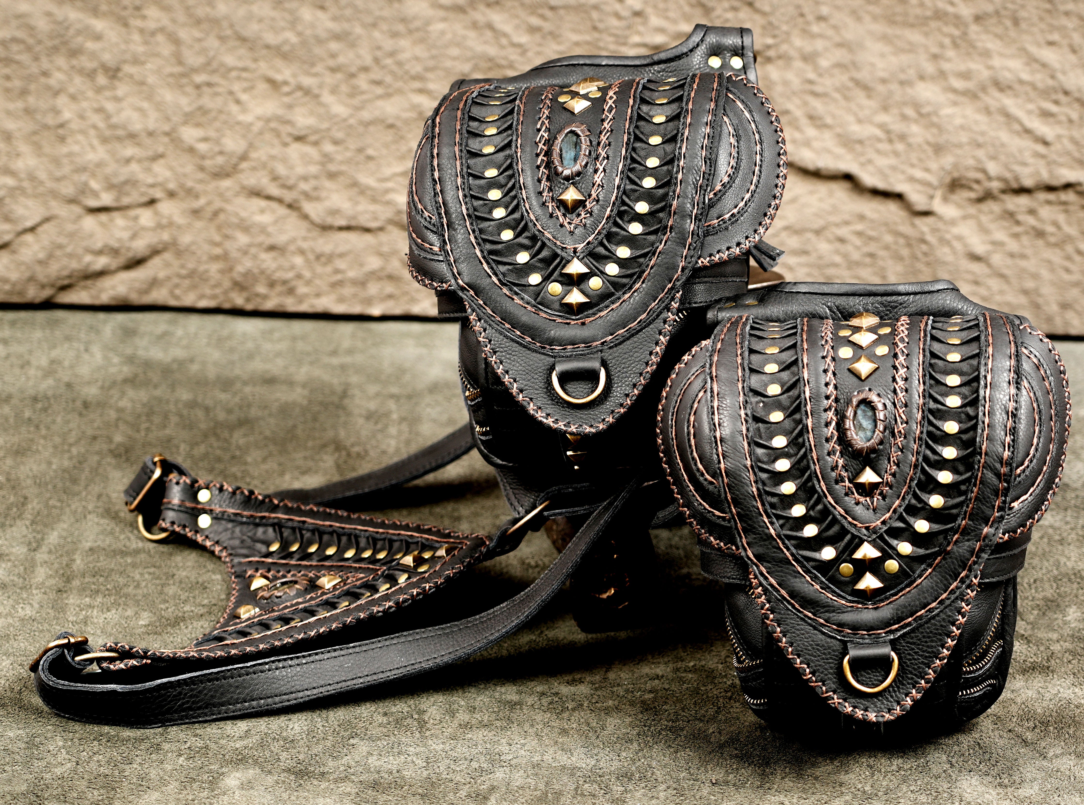 Steampunk-style black leather bag with adjustable shoulder straps