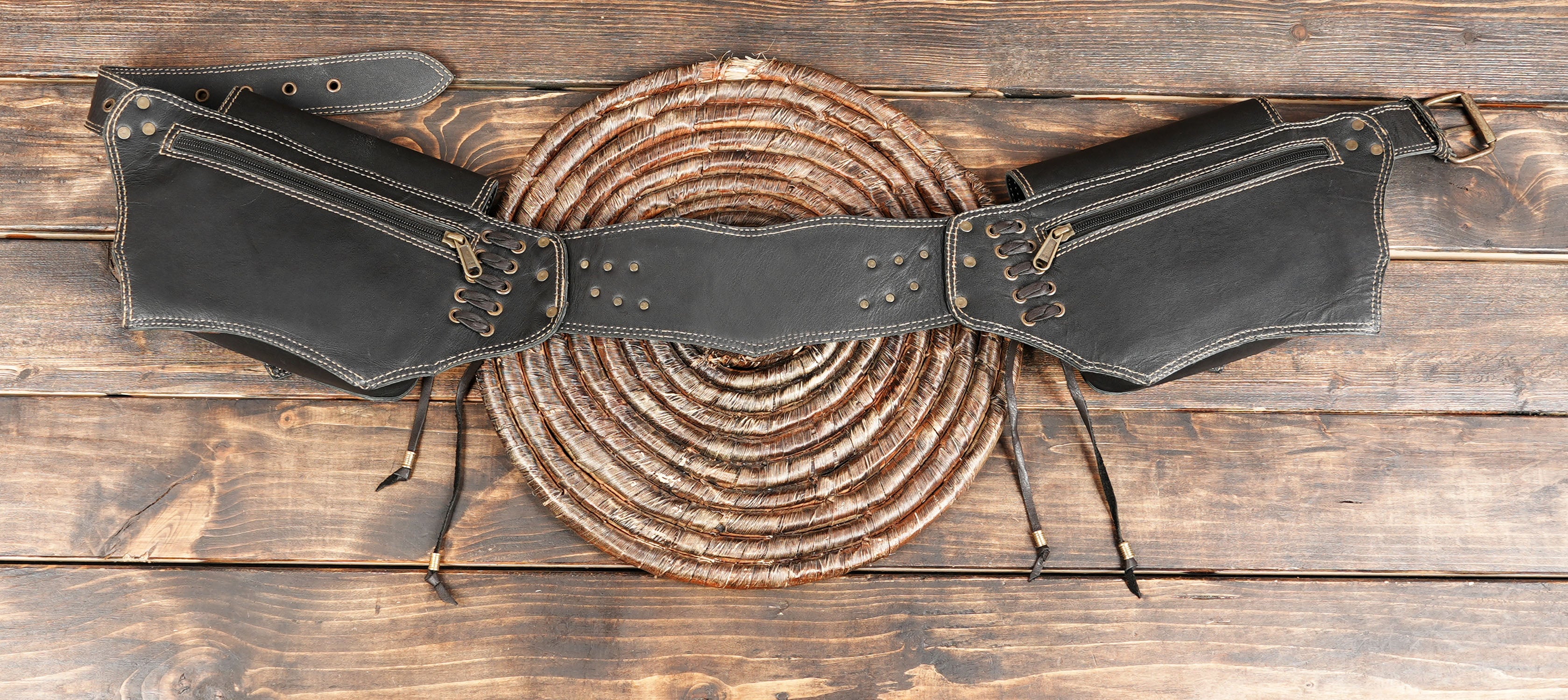 Steampunk-style leather belt bag with decorative front flaps