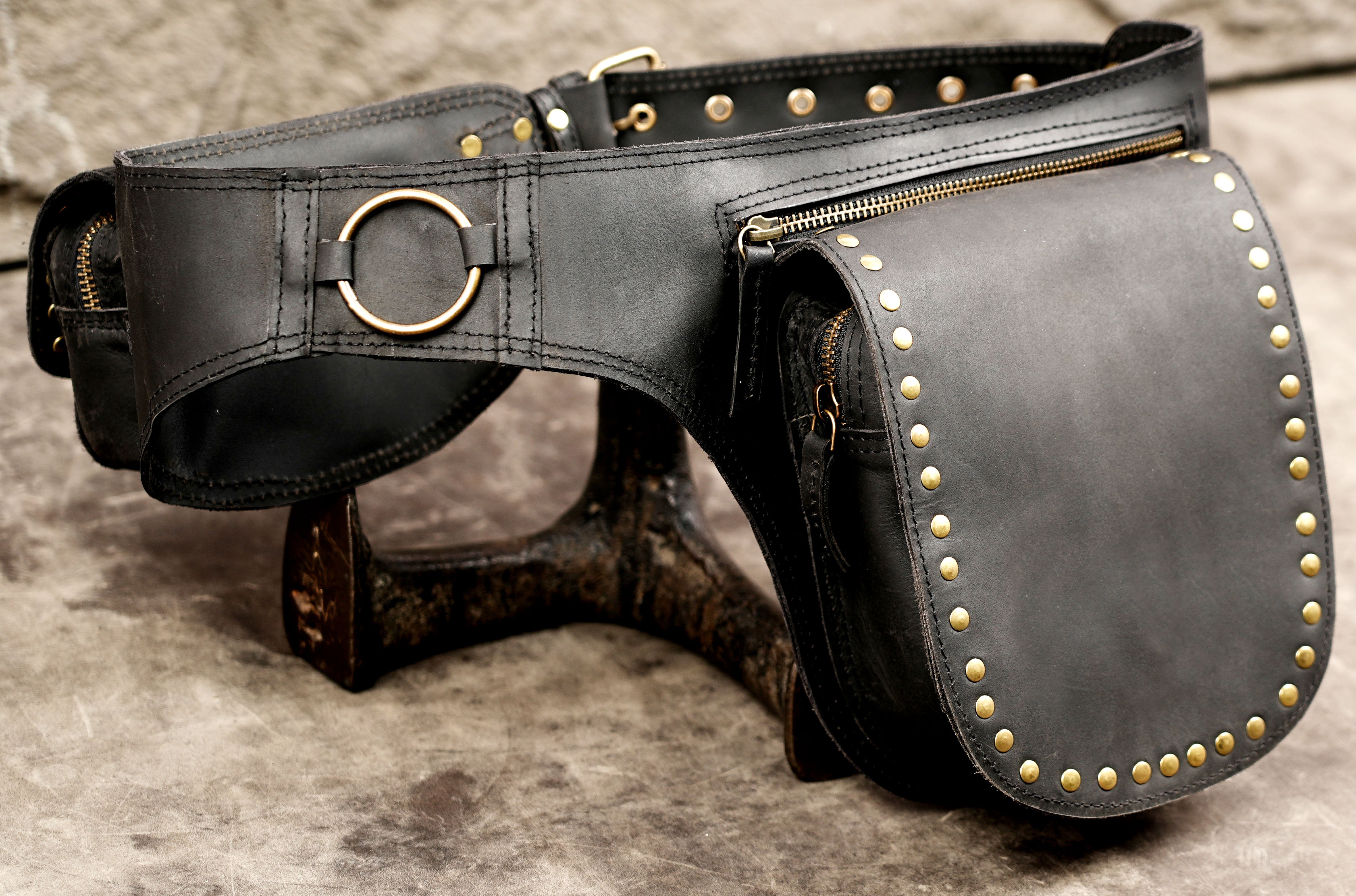Steampunk leather belt with brass ring and studded pouches
