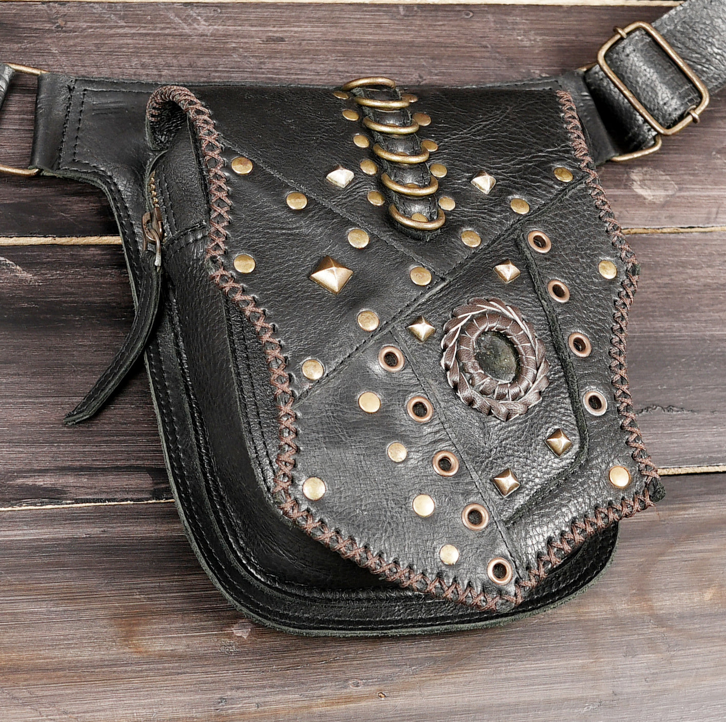 Steampunk leather pouch with braided stone medallion and rings