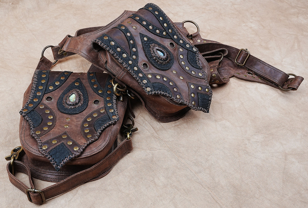 Handcrafted leather festival bag with matching hip pouches and antique brass hardware