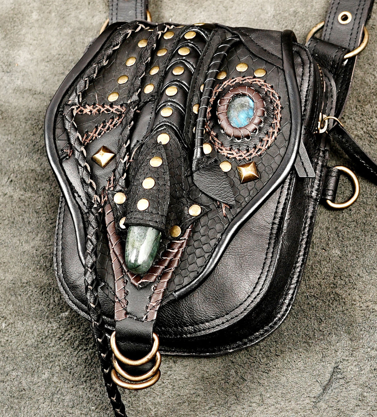 Black leather utility harness set with decorative metal studs and detailed stitching
 
