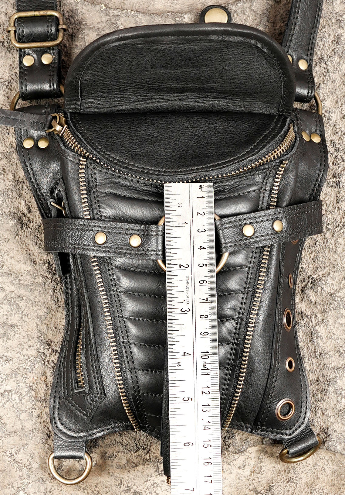 Black double pocket utility harness bag with quilted detailing and brass-tone hardware