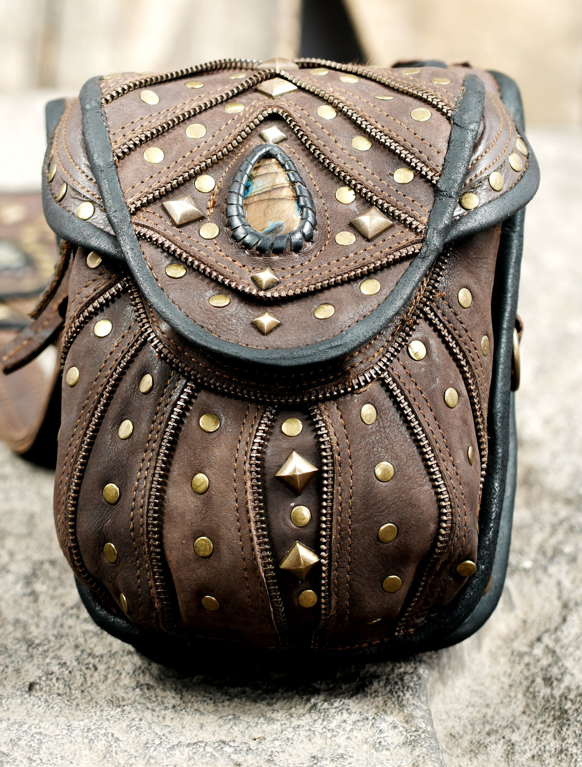 Handcrafted leather utility harness with twin storage bags and decorative metal studs