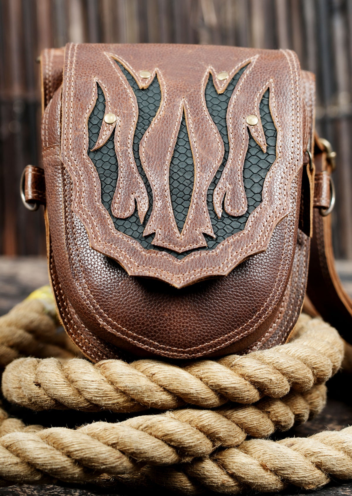 Brown leather utility thigh holster with antique brass rings and clips