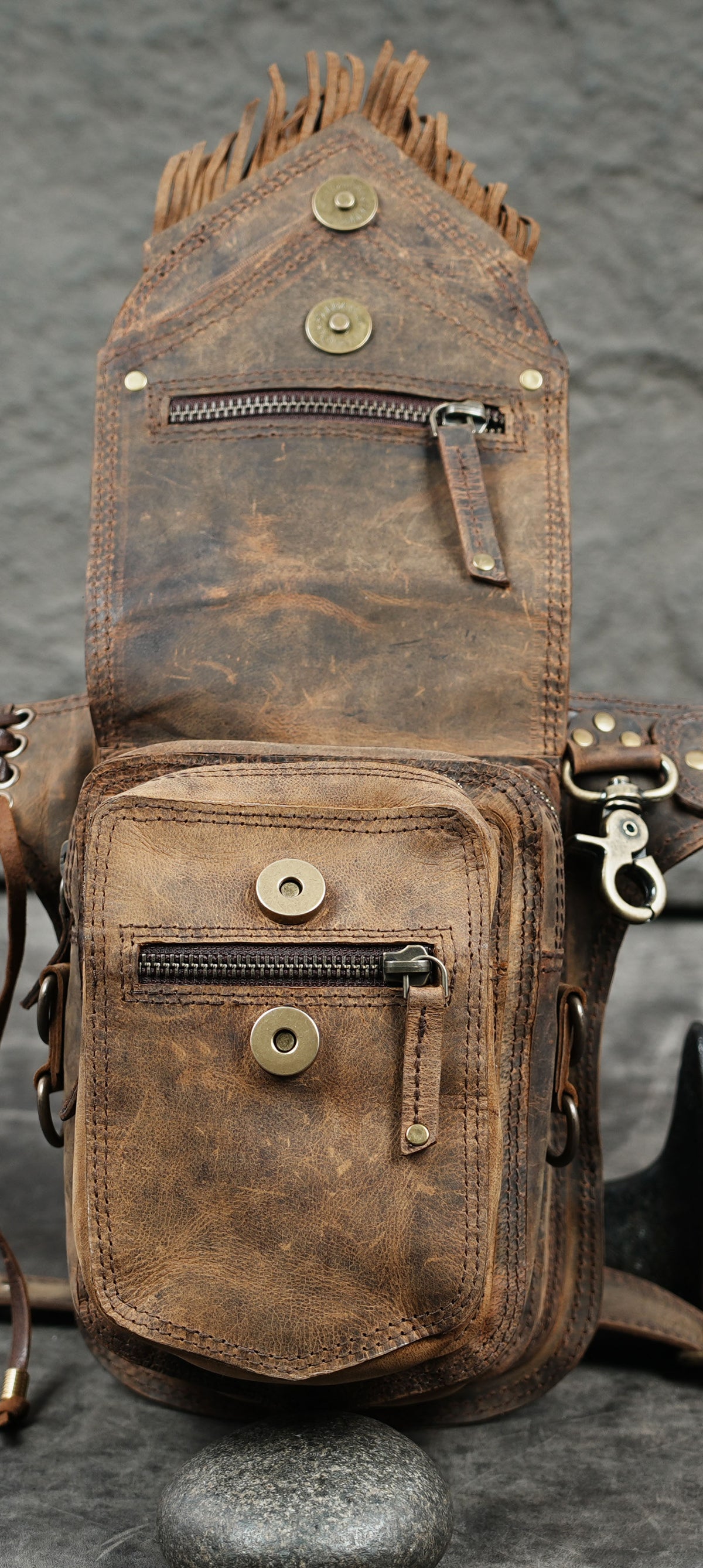 Handmade leather festival belt bag with fringe and decorative gemstone