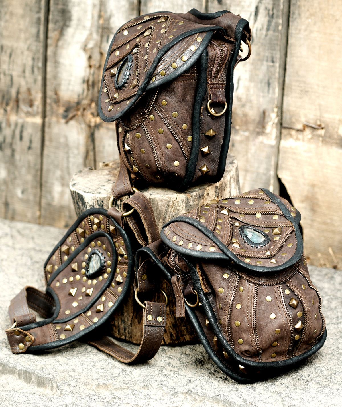Brown leather Burning Man harness with gemstone flap details and matching side pouches