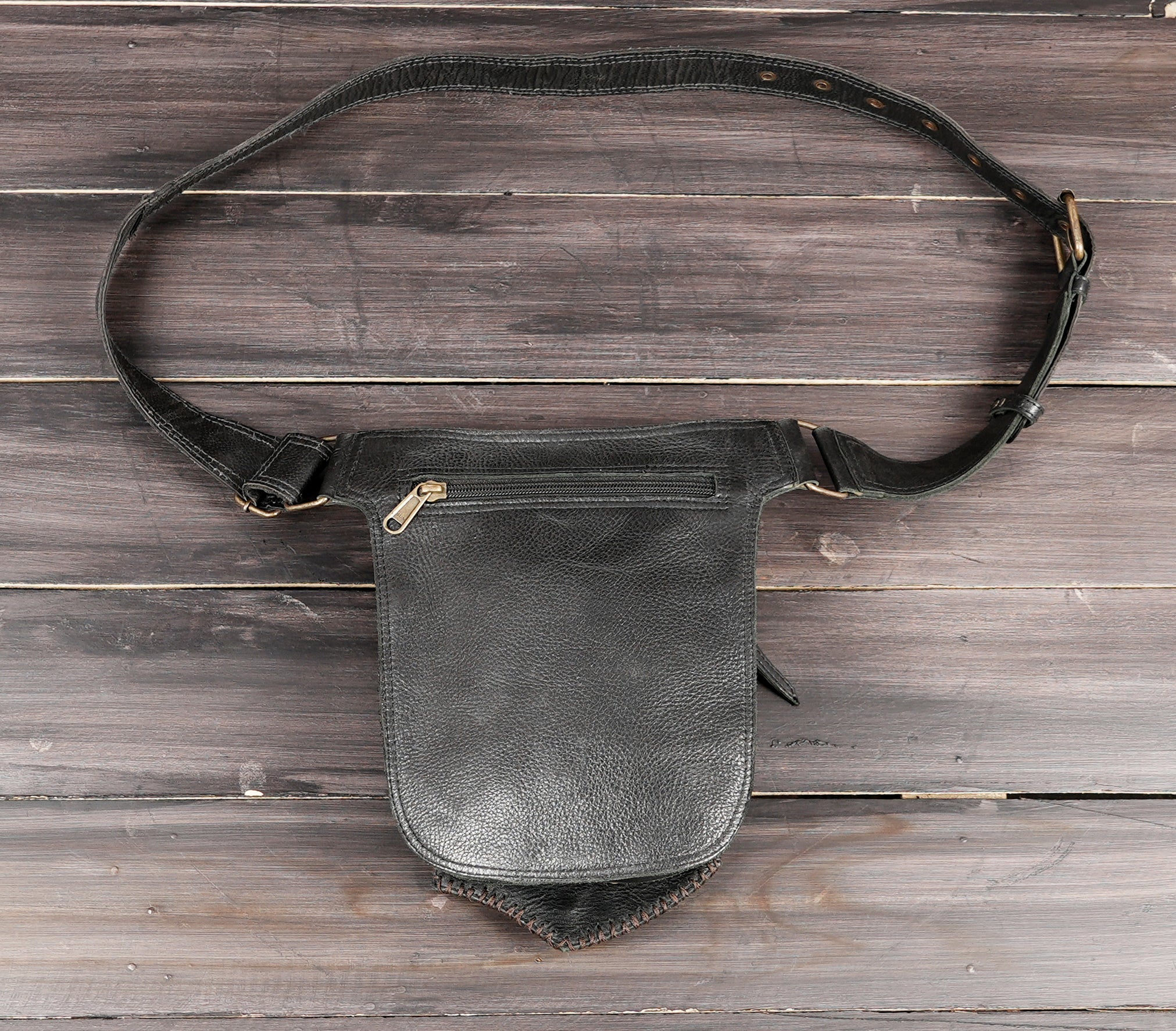 Studded leather waist bag with adjustable strap and buckle