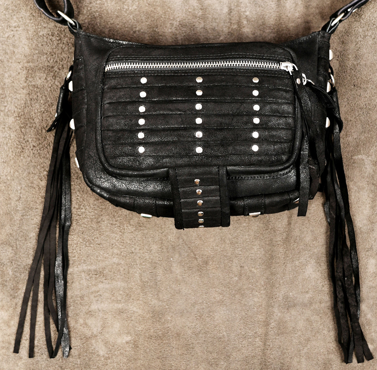 Suede leather purse with tassel fringe, flat lay view