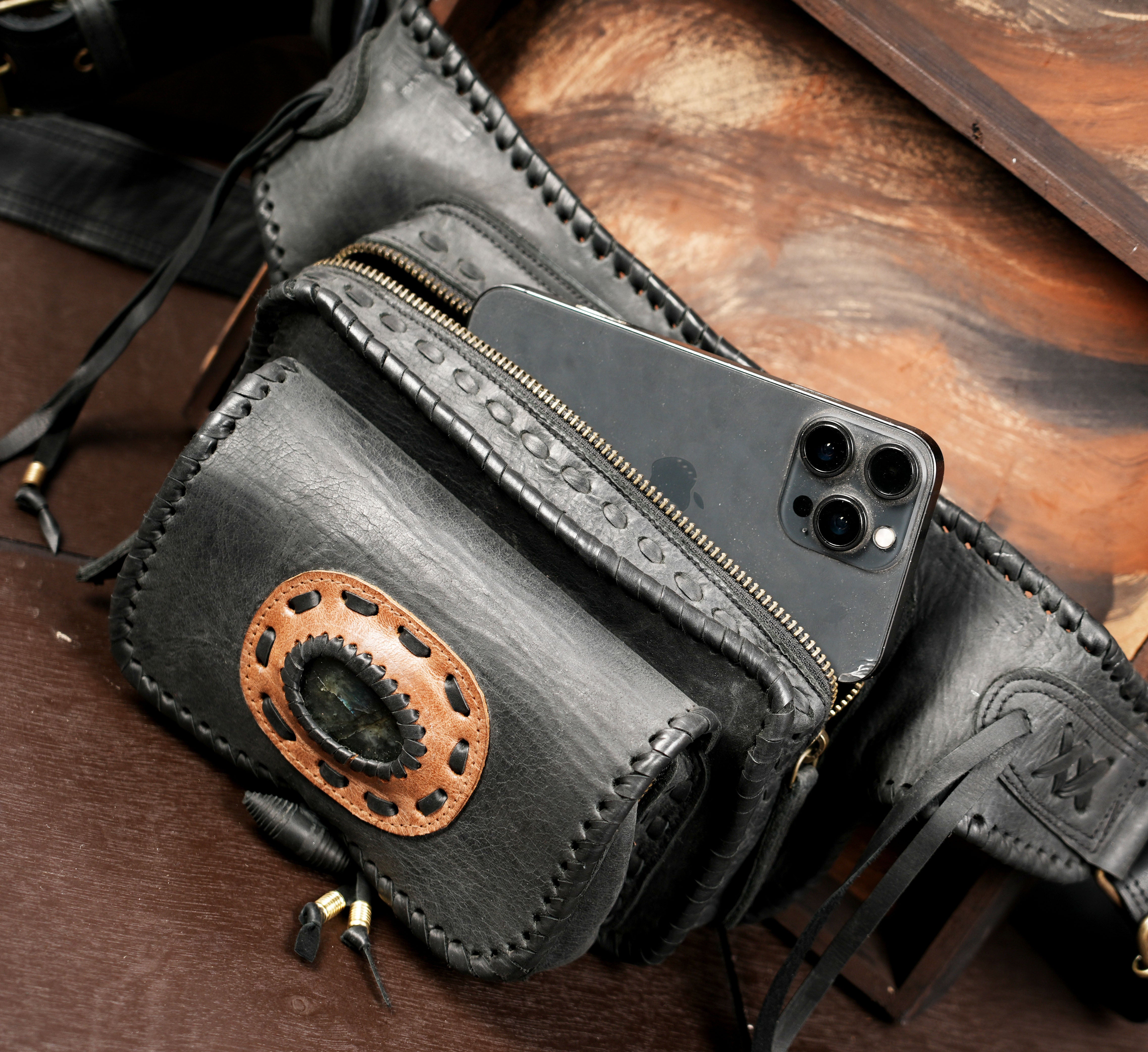 Tribal style leather waist bag with fringe ties and stone