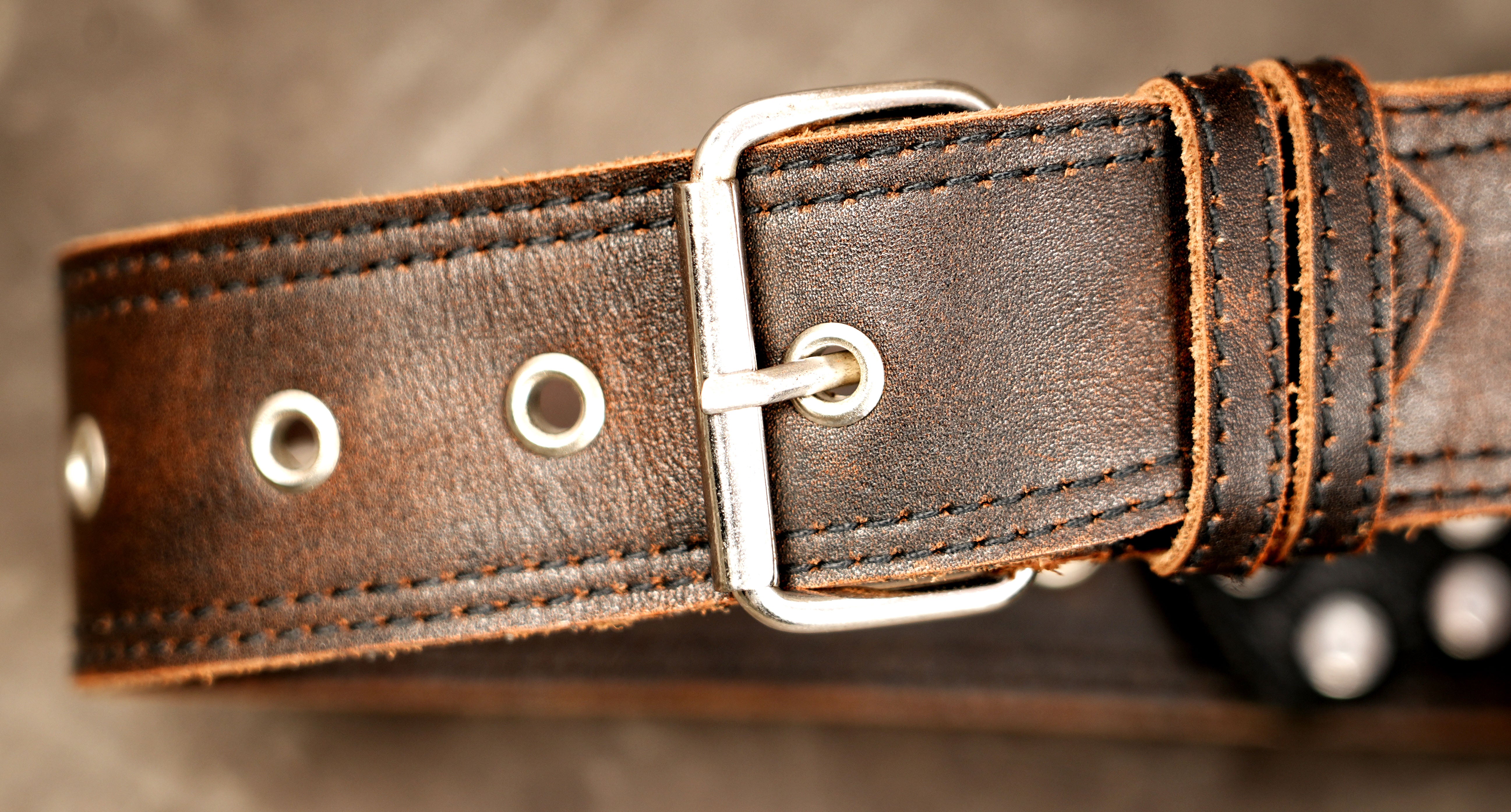 Two tone leather belt with braided gemstone medallion
