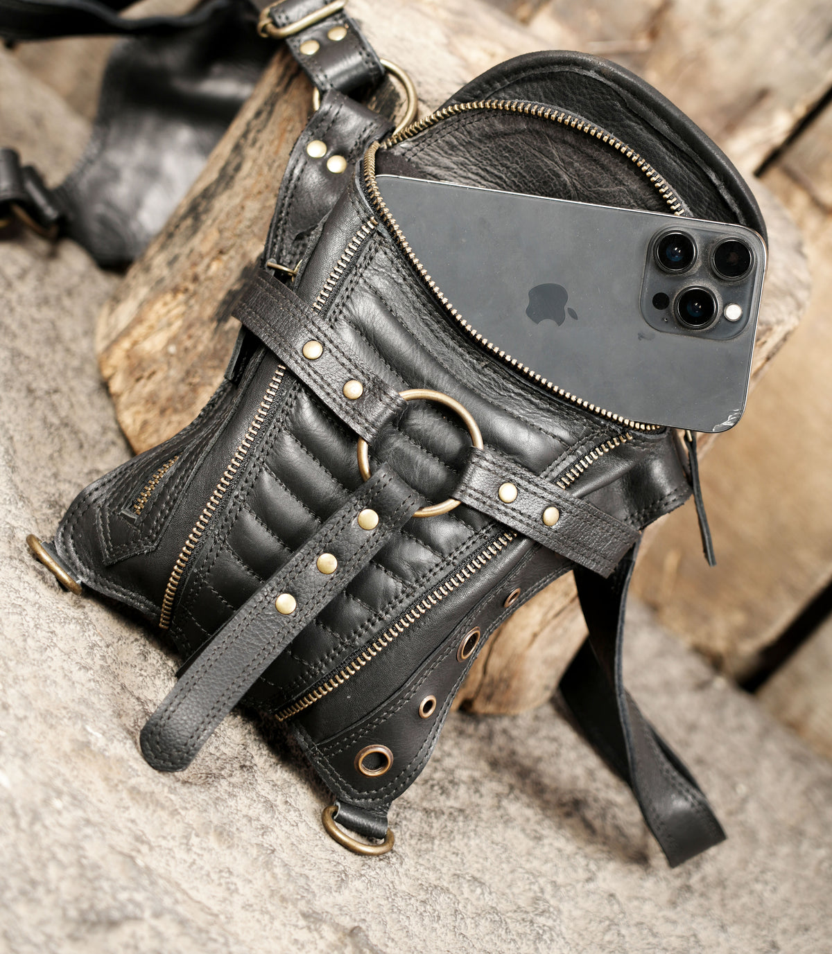 Black leather festival harness with front storage pockets and adjustable shoulder straps