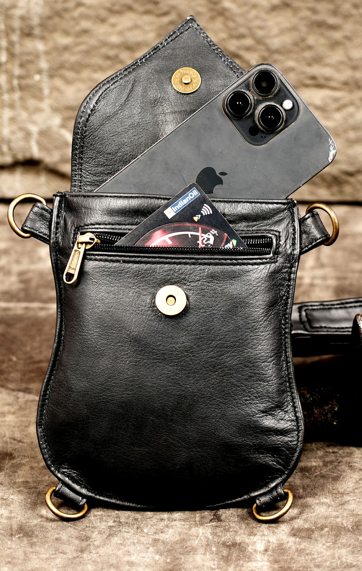 Black leather chest harness with adjustable straps and utility bags