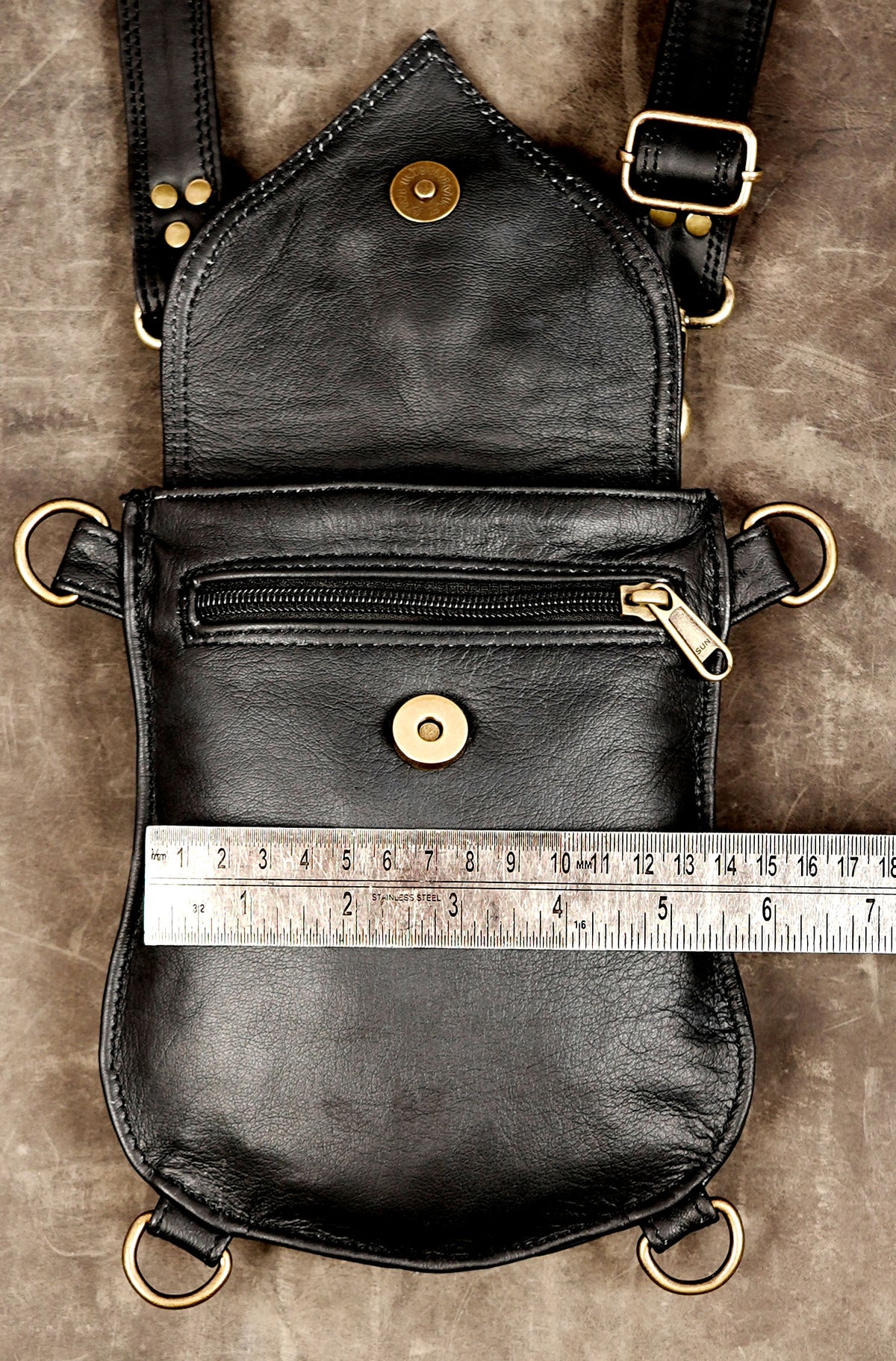Black leather festival harness bag with two front utility pouches