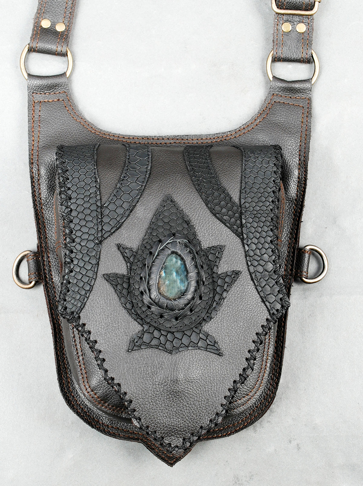Handmade unisex leather utility bag with dual hip pouches and adjustable harness straps.