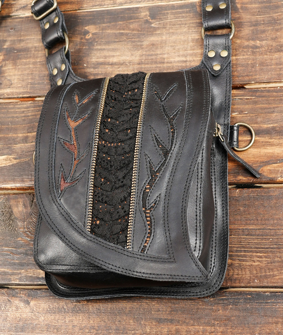Black leather utility shoulder bag with adjustable straps